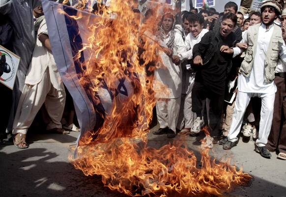 Afghan demonstrators set fire to a representation of the Israeli flag during a rally marking Al-Quds (Jerusalem) Day in Kabul, Afghanistan.