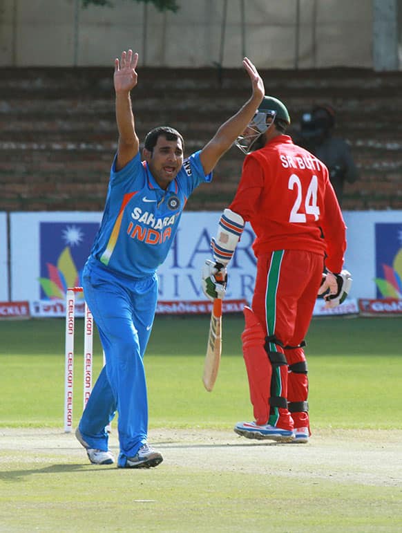 Indian bowler Mohammad Shami, left, appeals unsuccessfully for the wicket of Zimbabwean batsman Sikanda Raza Butt during their one-day international cricket match at Queens Sports Club in Bulawayo, Zimbabwe.