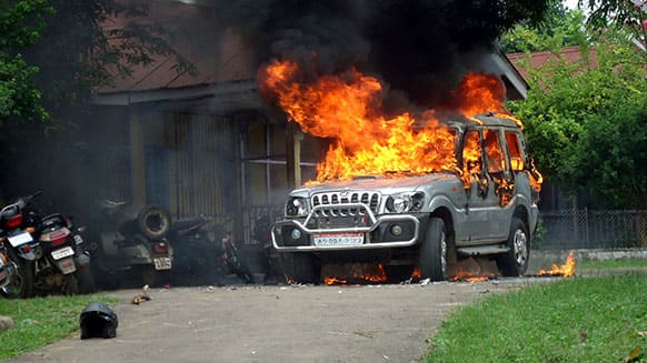 A vehicle goes up in flames after protestors demanding the creation of a separate Karbi Anglong state vandalized the residence of an official at Diphu, in Karbi Anglong district in northeastern Assam state, India.
