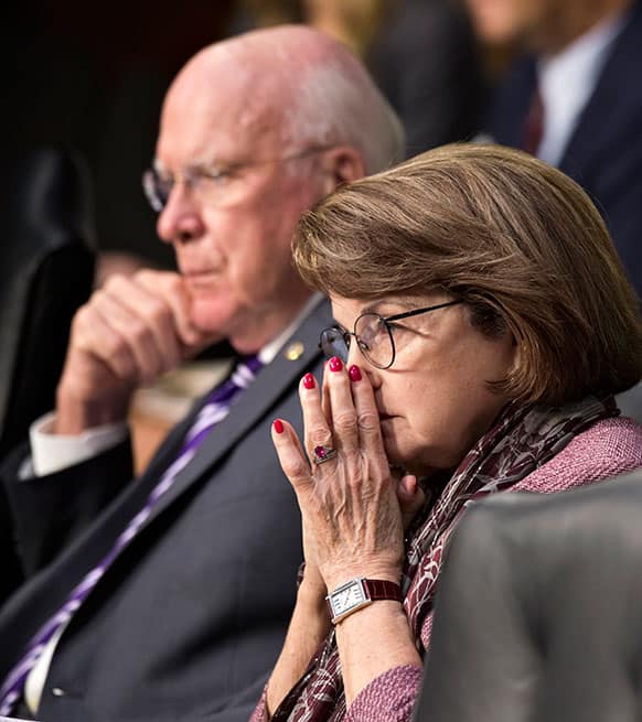 Senate Judiciary Committee Chairman Sen. Patrick Leahy, D-Vt., left, and Senate Intelligence Committee Chair Sen. Dianne Feinstein, D-Calif., listen on Capitol Hill in Washington.
