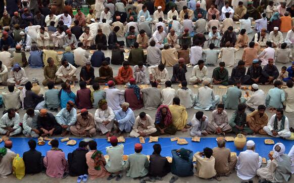 Pakistani Muslims wait for Iftar, breakfast in English, to break their dawn to dusk fast during Ramadan in Quetta, Pakistan.