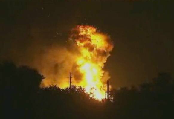 In this image taken from Associated Press video, flames rise from an explosion at the Blue Rhino propane plant in Tavares City, Fla.
