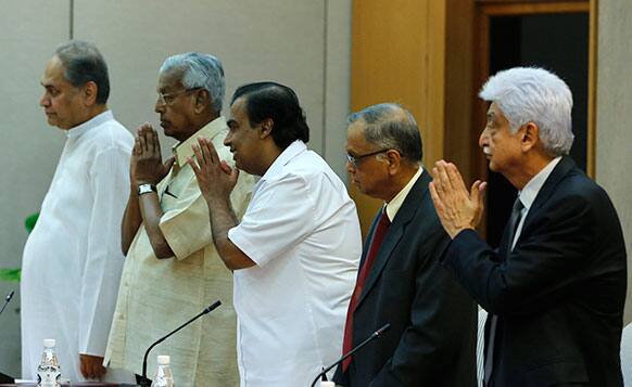 Indian business leaders, Wipro Chairman Azim Premji, Infosys founder NR Narayana Murthy, Reliance Industries Limited chairman Mukesh Ambani, and Bajaj group chairman Rahul Bajaj stand up to greet Indian PM Manmohan Singh prior to their meeting in New Delhi.