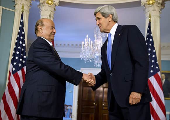 Secretary of State John Kerry shakes hand with with Yemen`s President Abed Rabbo Mansour Hadi, at the State Department in Washington.