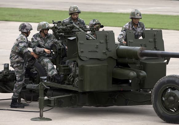 Soldiers operate the PG59 57mm anti-aircraft artillery gun during a demonstration at a base of People’s Liberation Army Lanzhou Military 47th Combined Corps anti-air brigade in Xi`an in northwest China`s Shaanxi province.