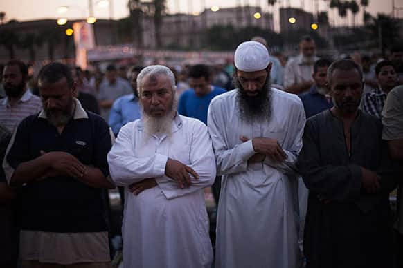 Supporters of Egypt`s ousted President Mohammed Morsi pray during a protest near Cairo University in Giza, Egypt.