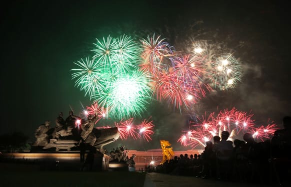 Fireworks explode behind the Fatherland Liberation War Museum as part of celebrations for the 60th anniversary of the Korean War armistice in Pyongyang, North Korea.