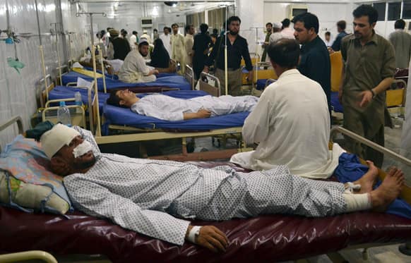 Injured victims of Friday`s bombing at a busy market, is treated at Lady Reading Hospital in Peshawar, Pakistan.