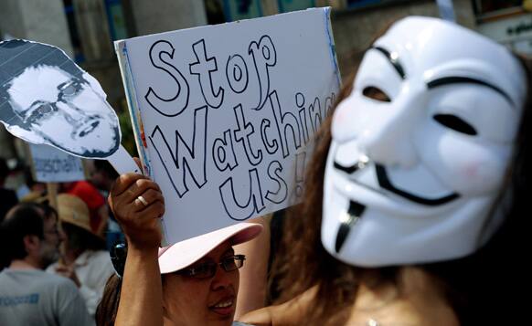 Protesters demonstrate against supposed NSA surveillance in Germany during a rally in Hannover, Germany.