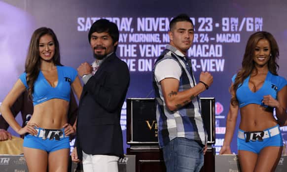Filipino boxer Manny Pacquiao, center left, poses with Brandon Rios of the United States during a news conference at the Venetian Macao in Macau.