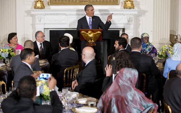 President Barack Obama speaks as he hosts an Iftar dinner celebrating Ramadan in the State Dining Room of the White House in Washington.