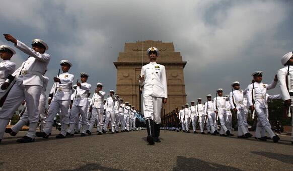 Indian navy personnel pay tribute at India Gate war memorial on the 14th anniversary of India`s victory in the Kargil War in New Delhi.