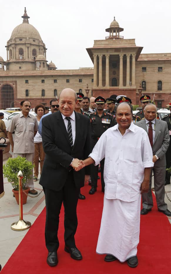 French Defense Minister Jean-Yves Le Drian poses for photographers with his Indian counterpart A.K Antony in New Delhi. Le Drian is on a three day visit to bolster defense ties with India.
