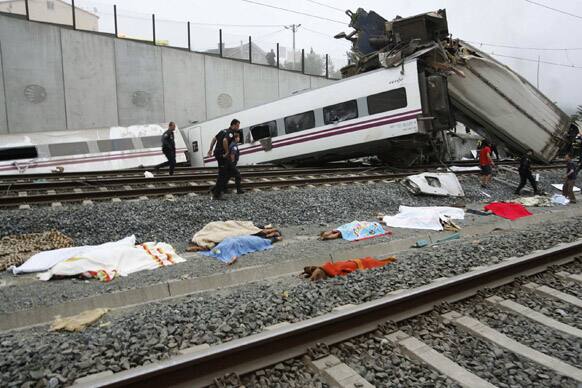 Emergency personnel respond to the scene of a train derailment in Santiago de Compostela, Spain.