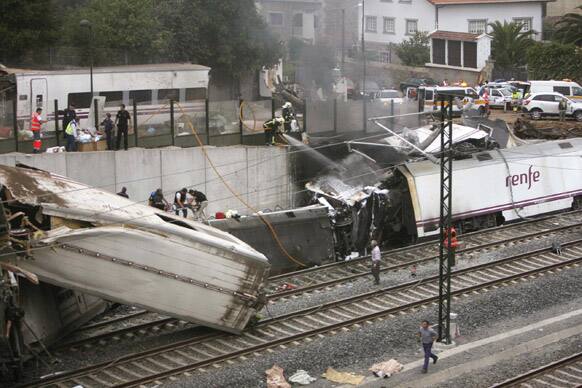 Emergency personnel respond to the scene of a train derailment in Santiago de Compostela, Spain.