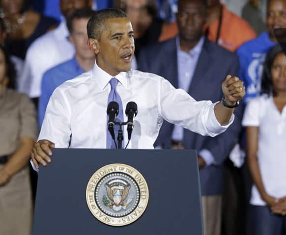 President Barack Obama gestures as he speaks about the economy, at the Jacksonville Port Authority in Jacksonville, Fla.
