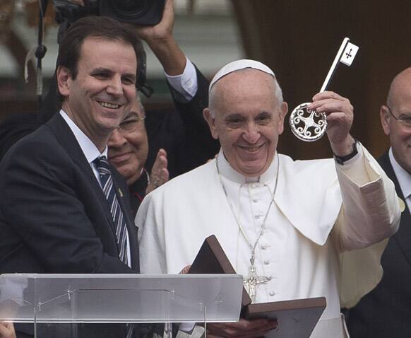 Pope Francis holds of the keys of the city as he stands next to Rio de Janeiro Mayor Eduardo Paes in Rio de Janeiro.