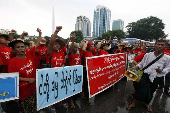 Holding placards reading