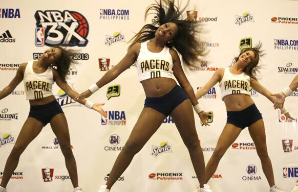Visiting NBA cheering squad, the Indiana Pacemates, perform during a news conference with NBA players James Harden of the Houston Rockets and Eric Gordon of the New Orleans Pelicans at a hotel in Manila.