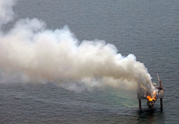 A fire is seen on the Hercules 265 drilling rig in the Gulf of Mexico off the coast of Louisiana. Natural gas spewed uncontrolled from the well on Tuesday after a blowout that forced the evacuation of 44 workers aboard the drilling rig, authorities said.