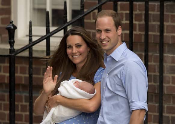 Britain`s Prince William and Kate, Duchess of Cambridge hold the Prince of Cambridge, as they pose for photographers outside St. Mary`s Hospital exclusive Lindo Wing in London where the Duchess gave birth on Monday July 22.