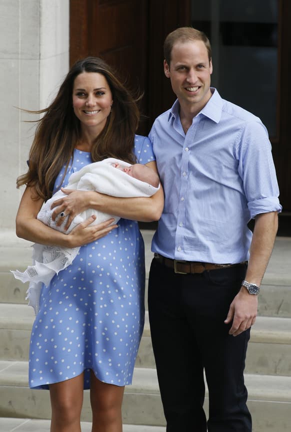 Britain`s Prince William and Kate, Duchess of Cambridge hold the Prince of Cambridge, as they pose for photographers outside St. Mary`s Hospital exclusive Lindo Wing in London where the Duchess gave birth on Monday July 22.