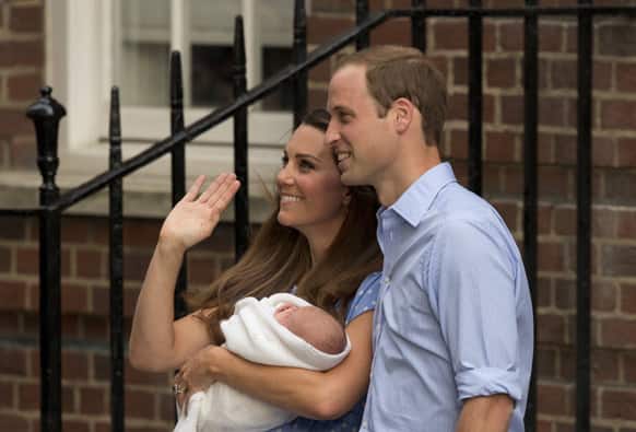 Britain`s Prince William and Kate, Duchess of Cambridge hold the Prince of Cambridge, as they pose for photographers outside St. Mary`s Hospital exclusive Lindo Wing in London where the Duchess gave birth on Monday July 22.
