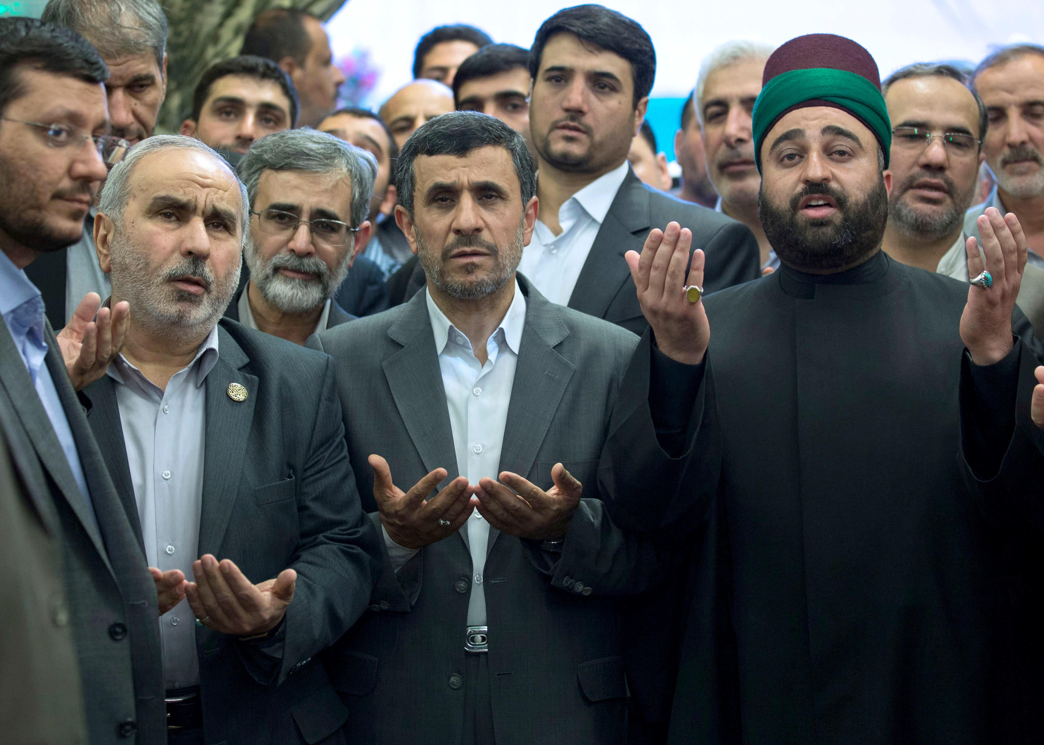 Iranian President Mahmoud Ahmadinejad, prays at the holy shrine of Imam Abbas in Karbala, Iraq. The outgoing Iranian president’s visits to the cities of Najaf and Karbala during the Islamic holy month of Ramadan followed meetings with top Iraqi officials in Baghdad.