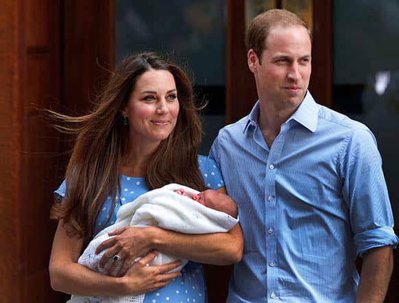 Britain`s Prince William, right, and Kate, Duchess of Cambridge hold the Prince of Cambridge, as they pose for photographers outside St. Mary`s Hospital exclusive Lindo Wing in London where the Duchess gave birth on Monday July 22.