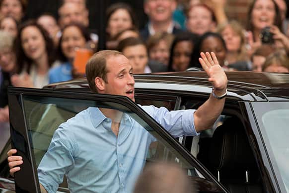 Britain`s Prince William waves as he walks to get in a vehicle to drive away, after posing with his wife Kate and their newly born baby son for photographers outside St. Mary`s Hospital exclusive Lindo Wing in London where the Duchess gave birth on Monday July 22.