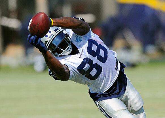 Dallas Cowboys wide receiver Dez Bryant makes a reception during NFL football training camp, in Oxnard, Calif.
