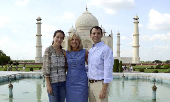 Jill Biden, wife of US Vice President Joe Biden, center, poses in front of the Taj Mahal with her daughter Ashley Biden and son-in-law Howard David Krein in Agra.