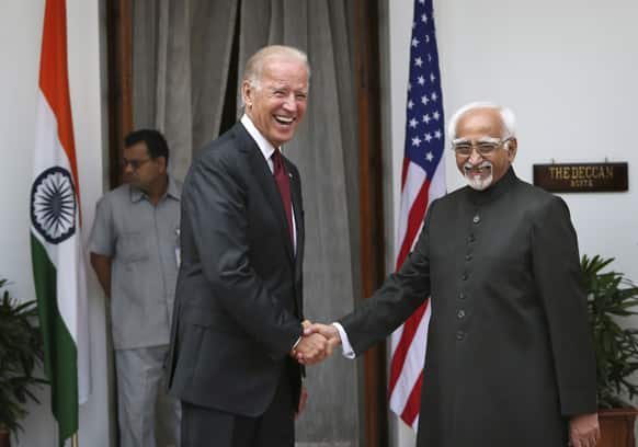 US Vice President Joe Biden shakes hands with Indian Vice President Hamid Ansari as they pose for the media before a meeting in New Delhi.
