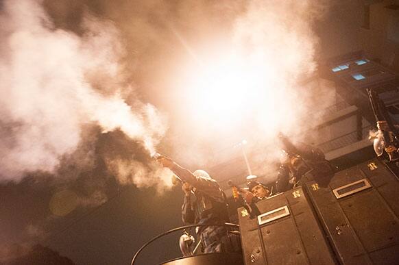 Military police fire tear gas into a crowd that had gathered to protest near Guanabara Palace in Rio de Janeiro, Brazil.