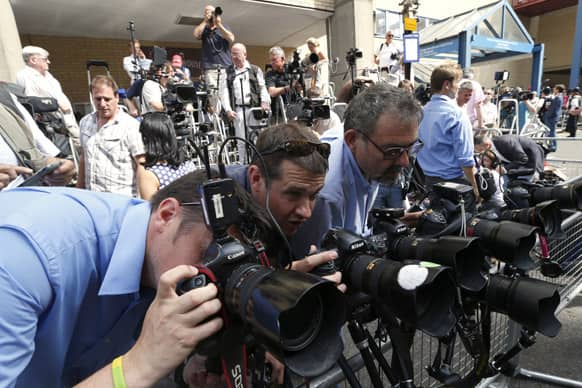 Photographers adjust their camera`s outside St. Mary`s Hospital exclusive Lindo Wing in London.