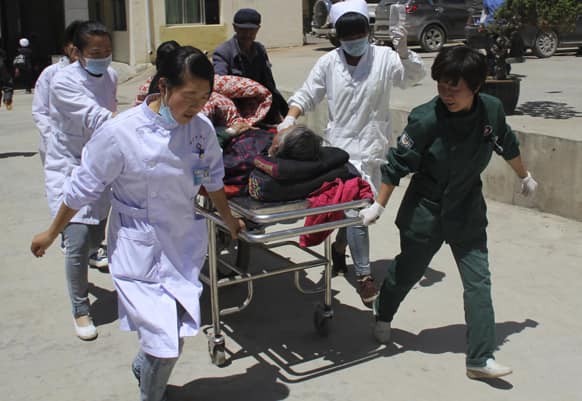 Medical workers attend to an injured at a hospital after an earthquake hit Minxian county in northwest China`s Gansu province.