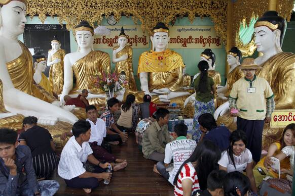 Buddhist devotees visit Shwedagon Pagoda during celebrations of the Full Moon day of Warso, the fourth month of Myanmar calendar, in Yangon, Myanmar.