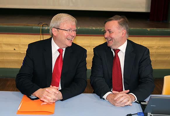 Australian Prime Minister Kevin Rudd, left, sits with Deputy Prime Minister Anthony Albanese at a federal caucus meeting in Sydney, Australia.