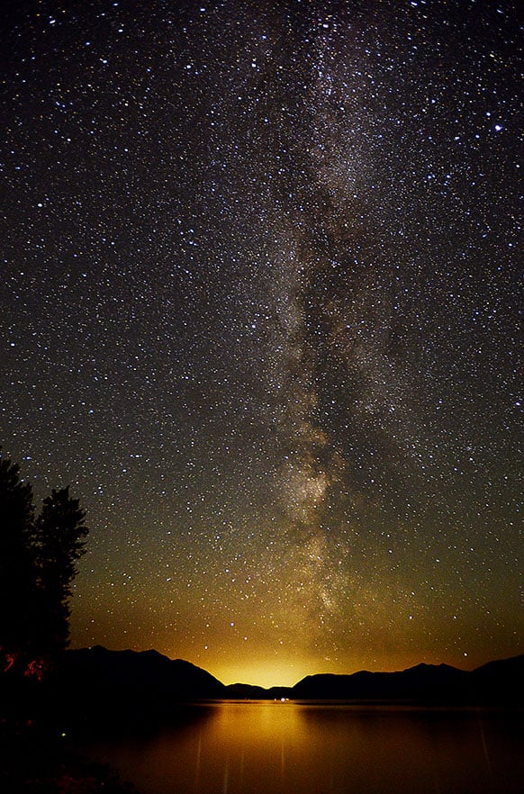 The Milky Way lights up the sky just after 3 a.m. on Thursday, July 18, 2013 over Lake McDondald in Glacier National Park, Mont.