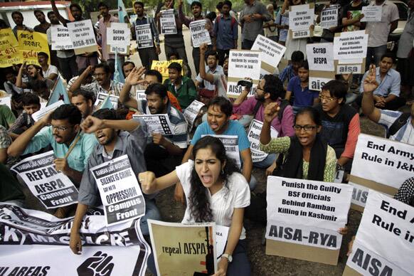 Activists of All India Student`s Association and Revolutionary Youth Association shout slogans and hold placards in New Delhi.