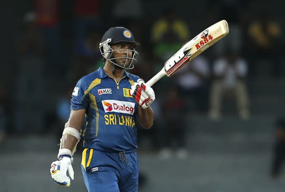 Sri Lanka`s batsman Kumar Sangakkara celebrates scoring a hundred and fifty runs during their first One Day International cricket match against South Africa in Colombo.