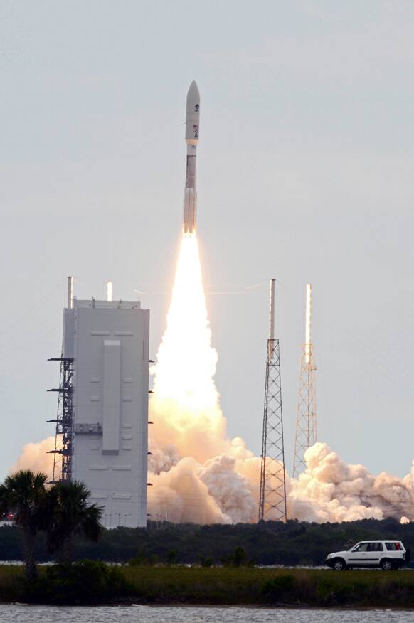An unmanned Atlas 5 rocket lifts off, launching a new military communications satellite, from Cape Canaveral Air Force Station.