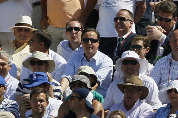Britain`s Prime Minister sits amongst the public during day two of the second Ashes Test at Lord`s cricket ground in London.