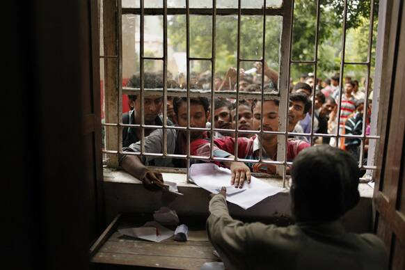 Job seekers queue up to register themselves for the post of police constable in Uttar Pradesh state police department in Allahabad.
