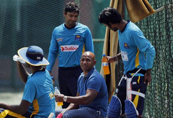 Sri Lanka`s chief cricket selector Sanath Jayasuriya chats with players during a practice session ahead of their first One Day International (ODI) cricket match against South Africa in Colombo.