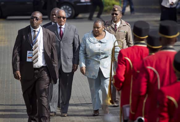 South African President Jacob Zuma walk towards a military band outside the Mediclinic Heart Hospital where former South African President Nelson Mandela is being treated in Pretoria, South Africa. South Africa celebrated Nelson Mandela`s 95th birthday on Thursday.