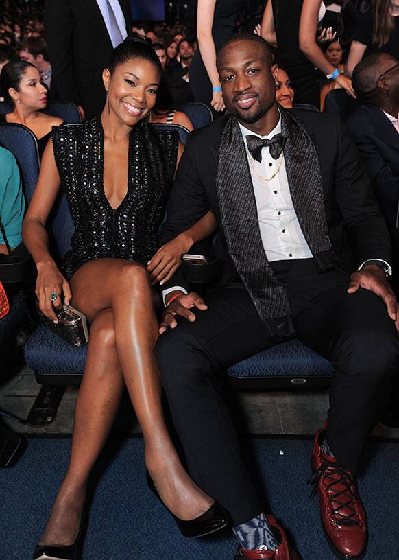 Gabrielle Union, left, and Dwyane Wade pose in the audience at the ESPY Awards at Nokia Theater in Los Angeles.