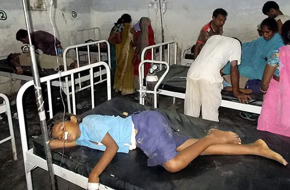 Schoolchildren receive treatment at a hospital after falling ill soon after eating a free meal at a primary school in Chhapra district, in the eastern Indian state of Bihar. At least 20 children have died and more are sick after eating free meals in the school.