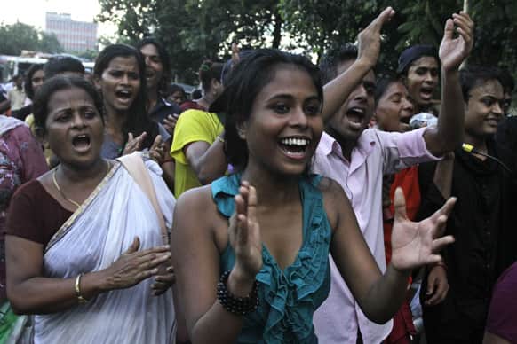 Sex workers and activists shout slogans as they take part in a rally demanding rights, dignity and social protection for the workers in Kolkata.