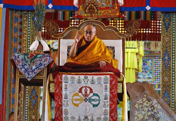 Tibetan spiritual leader the Dalai Lama sits on a throne as he delivers a religious sermon on the last day of five day teachings at the Gyudmed Tantric Monastery in Gurupura 212 kilometers (132 miles) southwest of Bangalore.